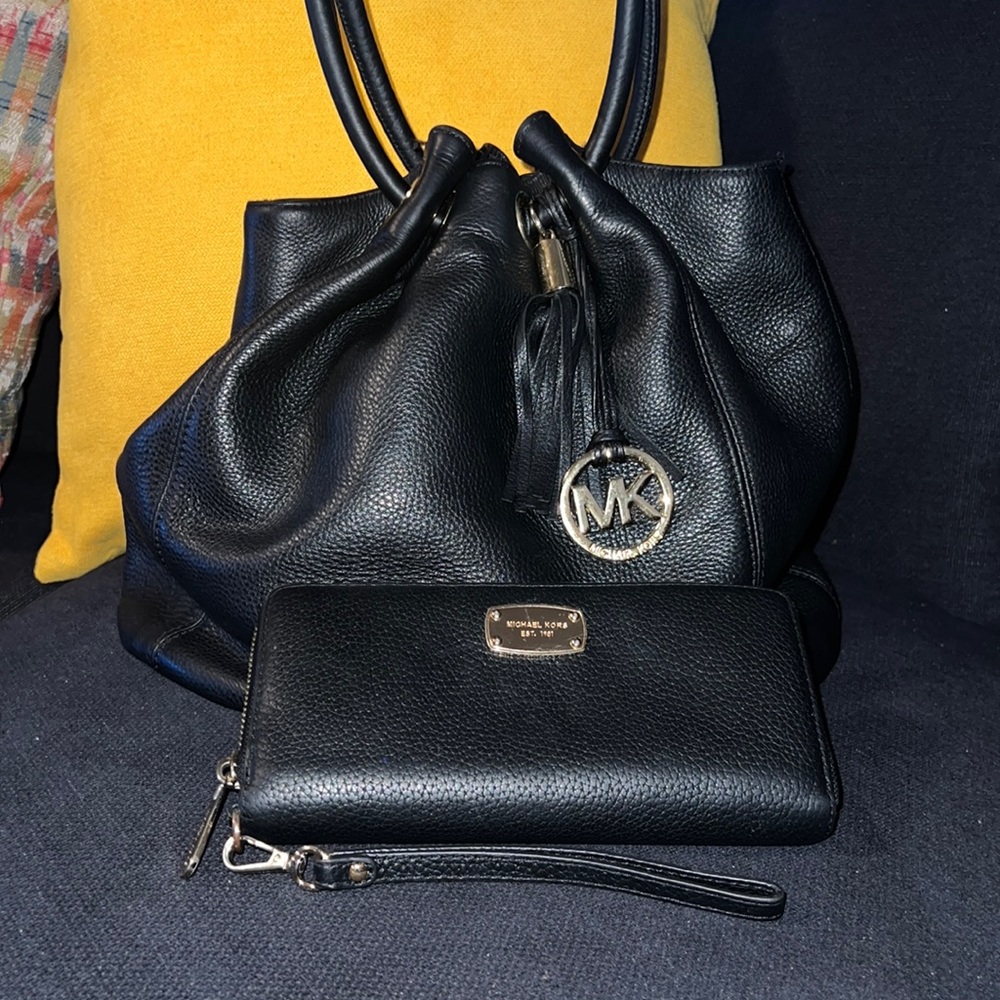 Gently used Michael Kors black purse with matching wallet